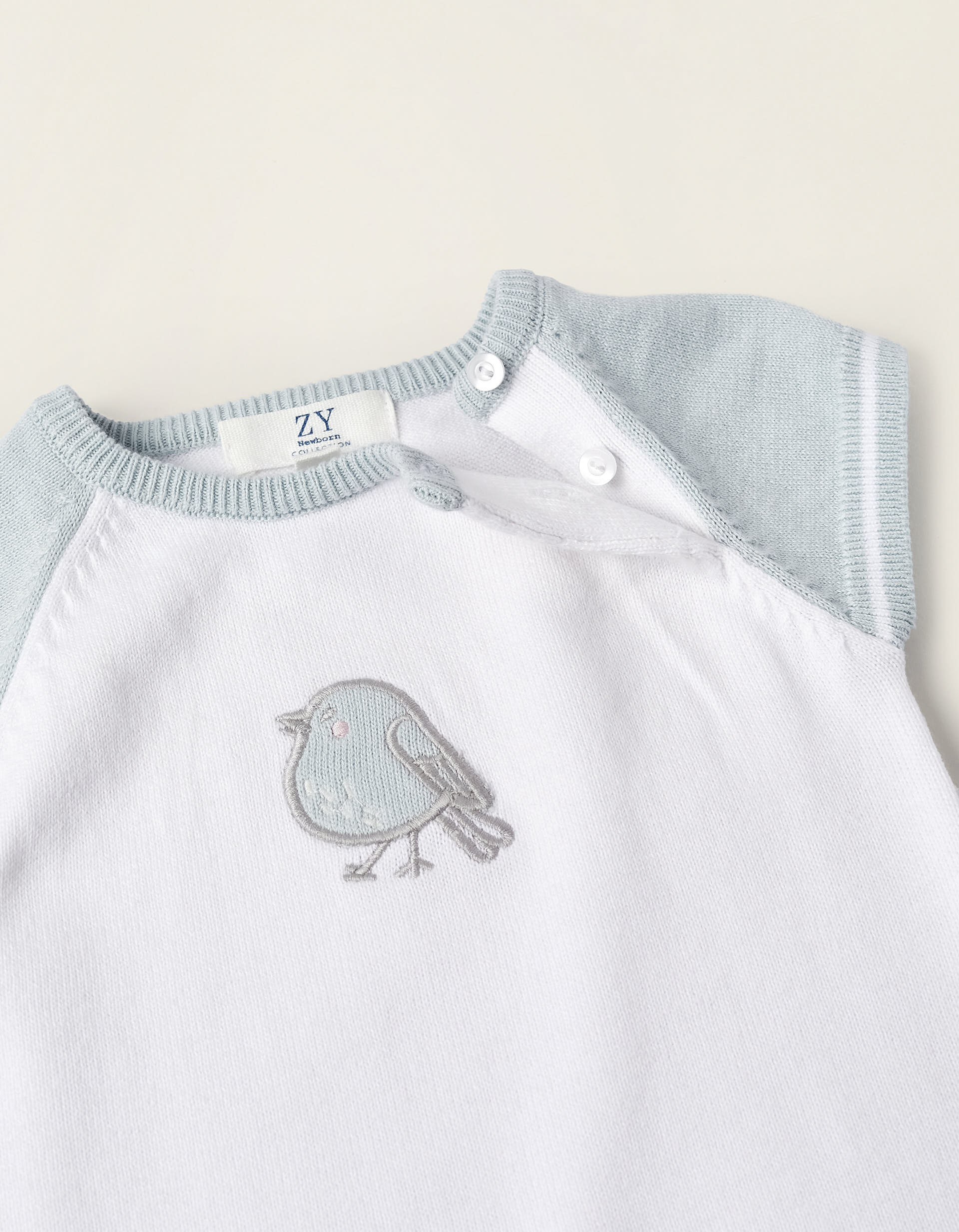 Short Knit Romper for Newborns 'Bird', White/Blue