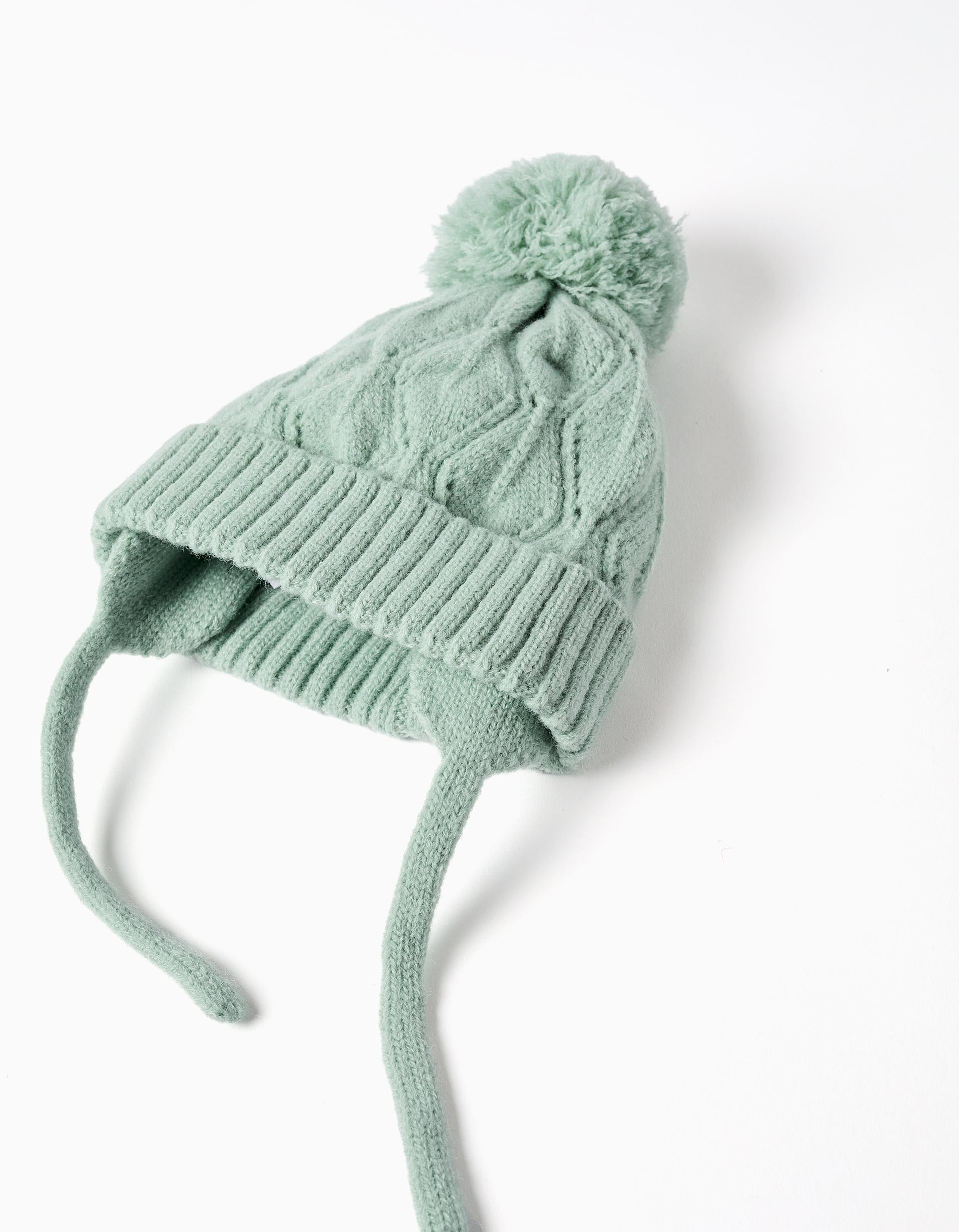 Cable knit beanie with pompon and straps for baby girls, light green