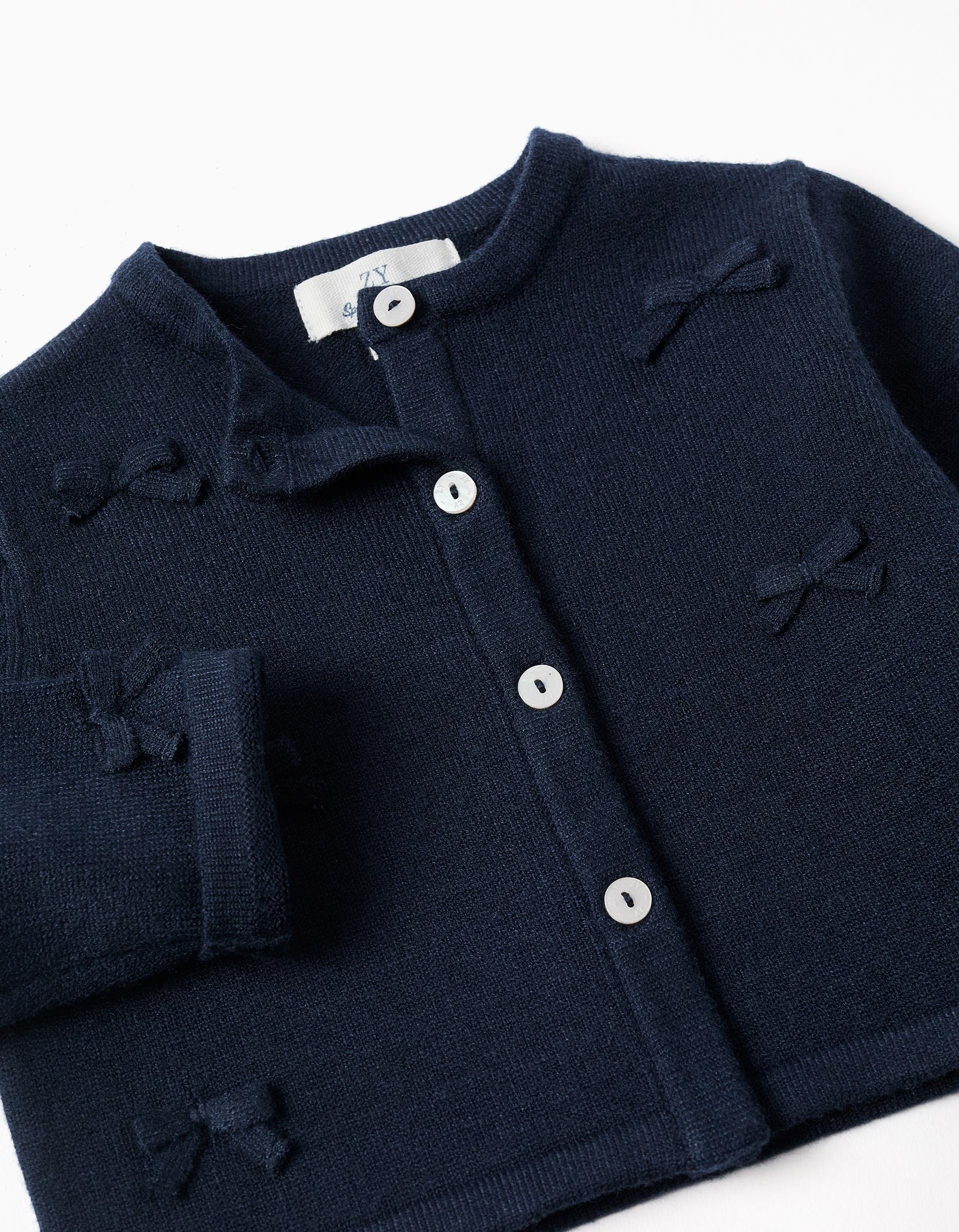 Cropped knitted cardigan with bows for baby girls, dark blue