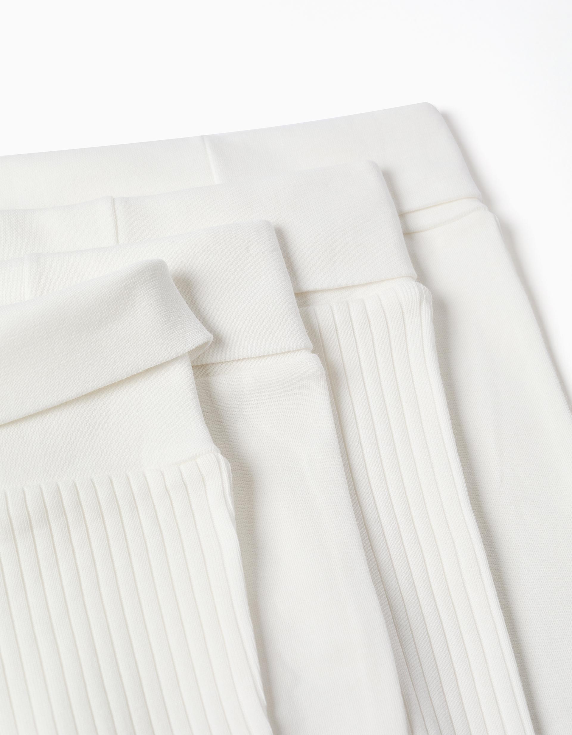 4 pantalones lisos/acanalados de algodón para recién nacidos, blanco