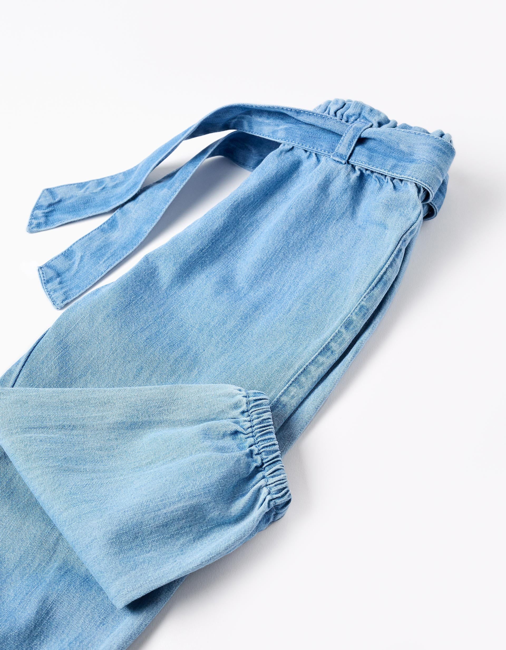 Denim trousers with paperbag waist and belt for baby girls, blue