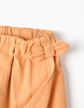 Cotton skort with decorative bow for baby girls, orange