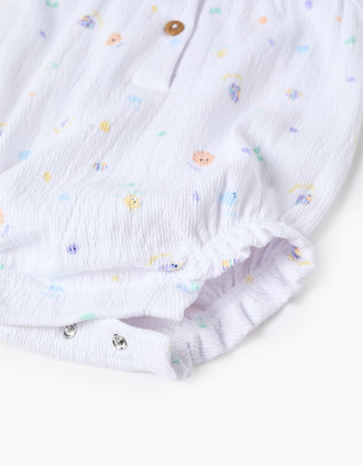Sleeveless cotton romper with motif and ruffles for newborn girls, white