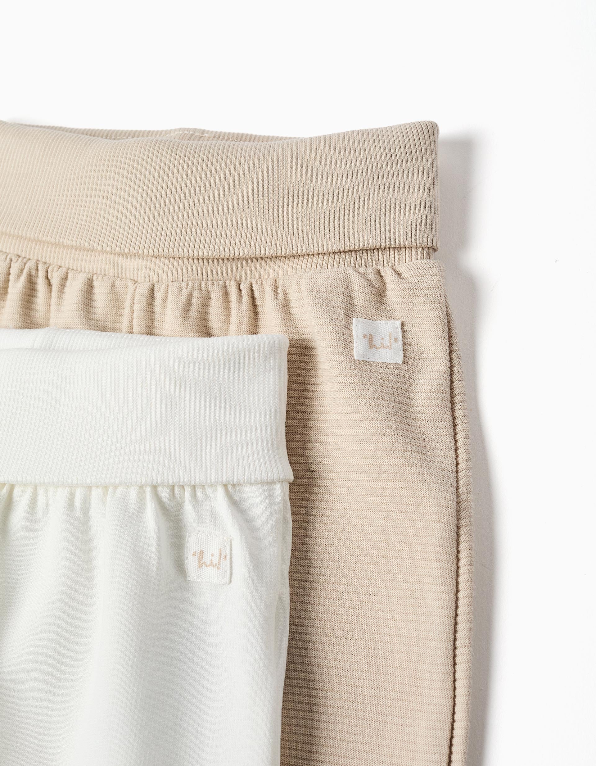 Pack of 2 plain/ribbed cotton trousers for newborns, white/beige