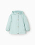 Hooded windbreaker with ruffles for girls, light blue