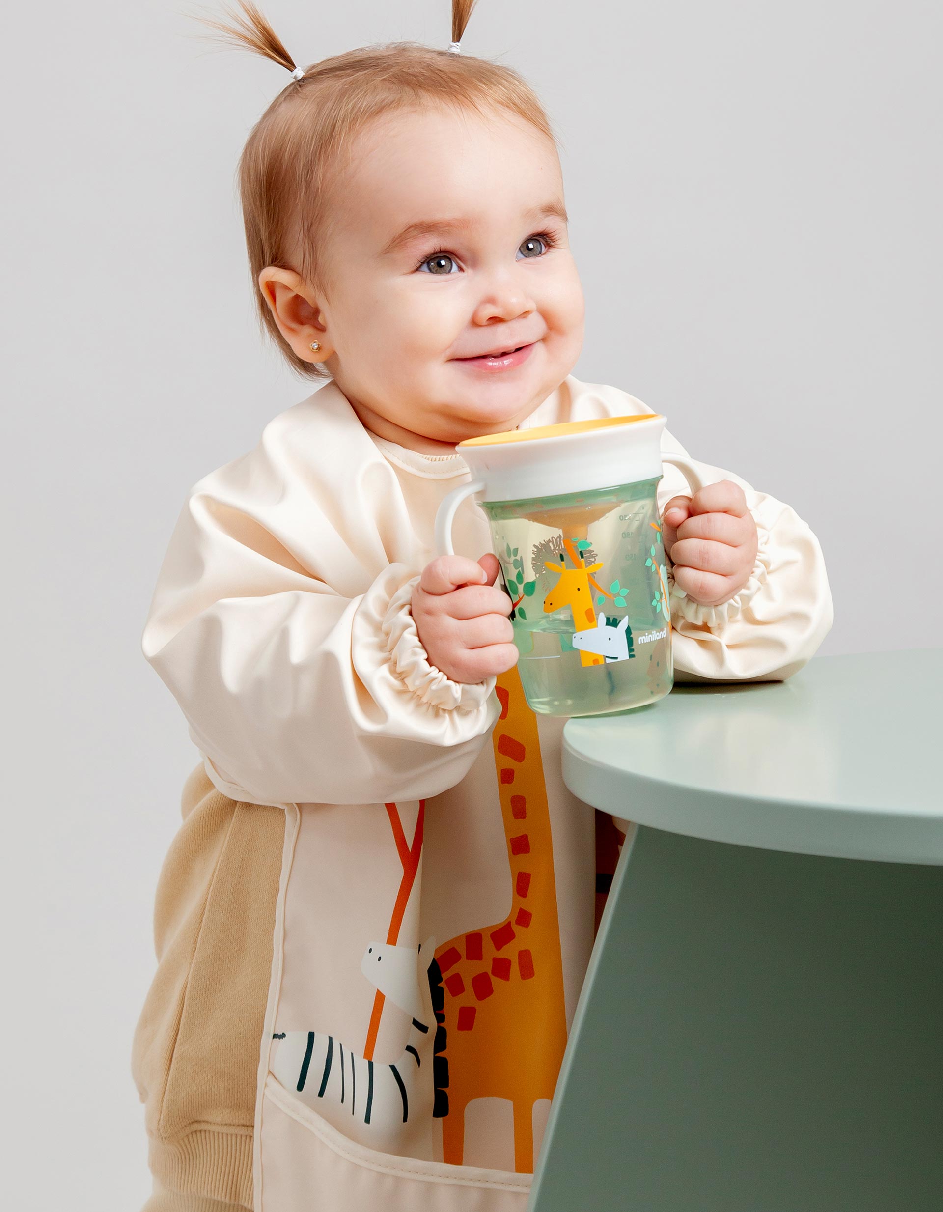 Jungle Waterproof Soft Bib with Sleeves and Pocket by Miniland