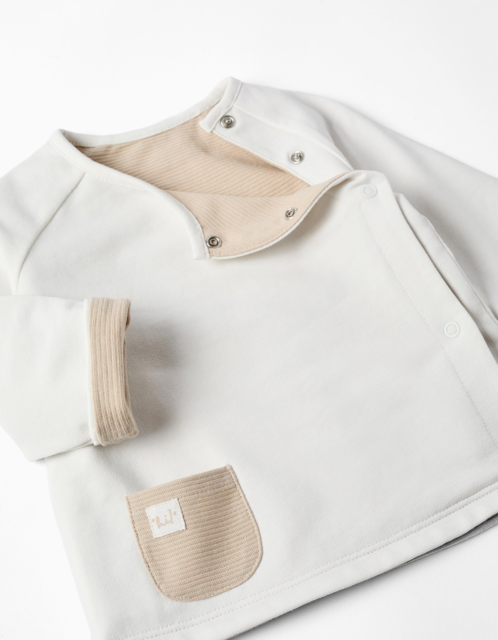 Veste réversible en coton pour nouveau-nés, blanc/beige