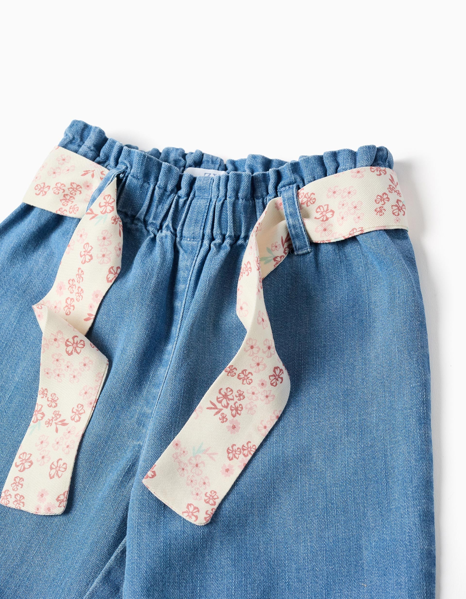Denim paperbag trousers with floral belt for baby girls, blue