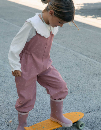 Rubber rain dungarees with floral print for girls, pink