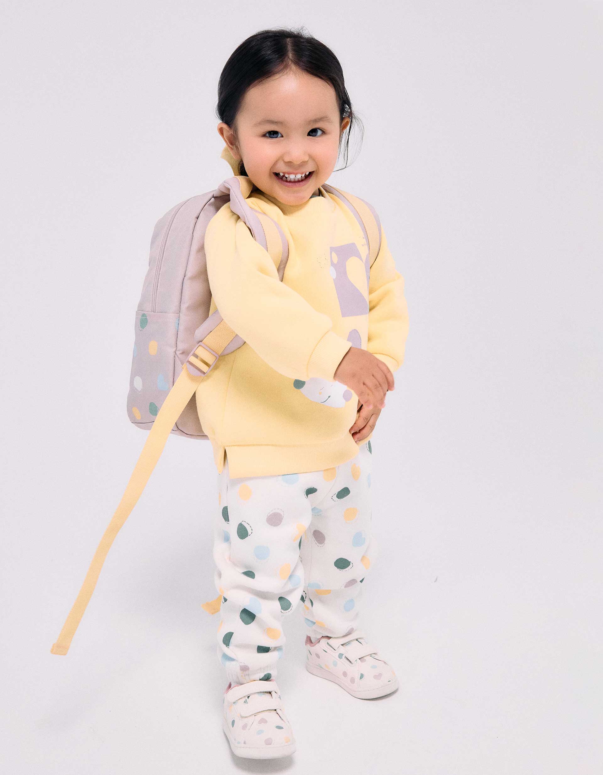 Brushed fleece trousers with dots pattern for baby girls, white