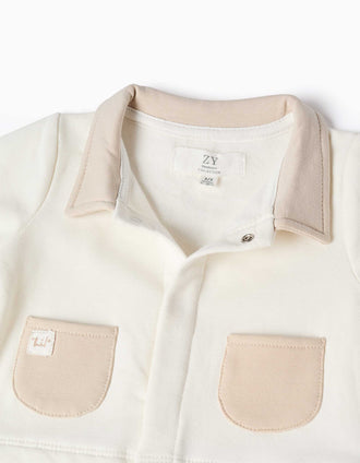 Footless sleepsuit with brushed interior for newborns, white/beige