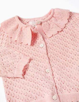 Gilet en maille ajourée avec bords festonnés pour nouveau-née, rose