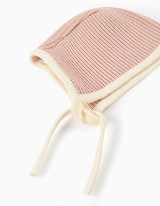 Ribbed knit bonnet with side straps for newborn girls, pink/white