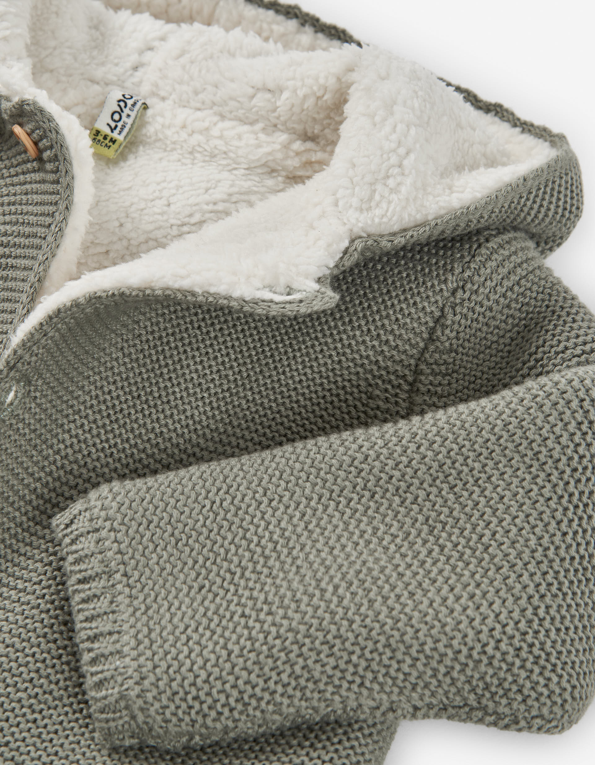 Hooded knitted jacket with sherpa lining for newborn, green