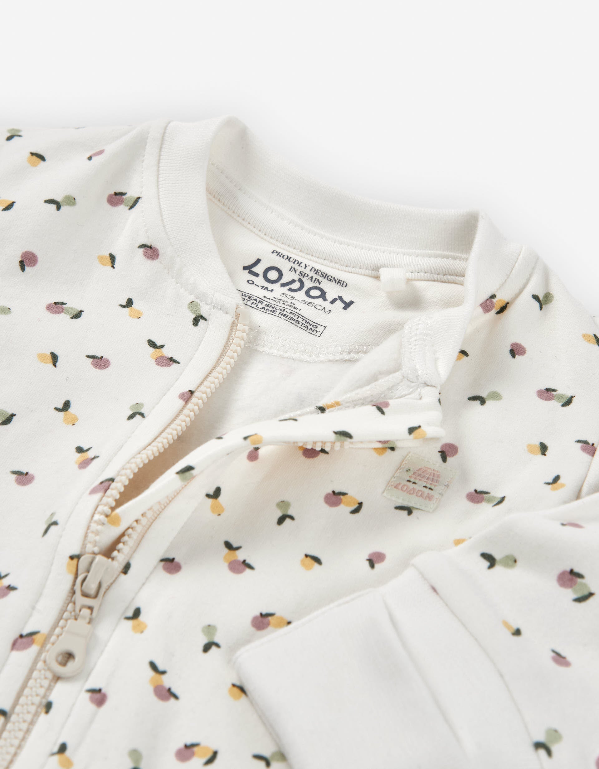 Brushed sleepsuit with fruit motif for newborn girls, light beige