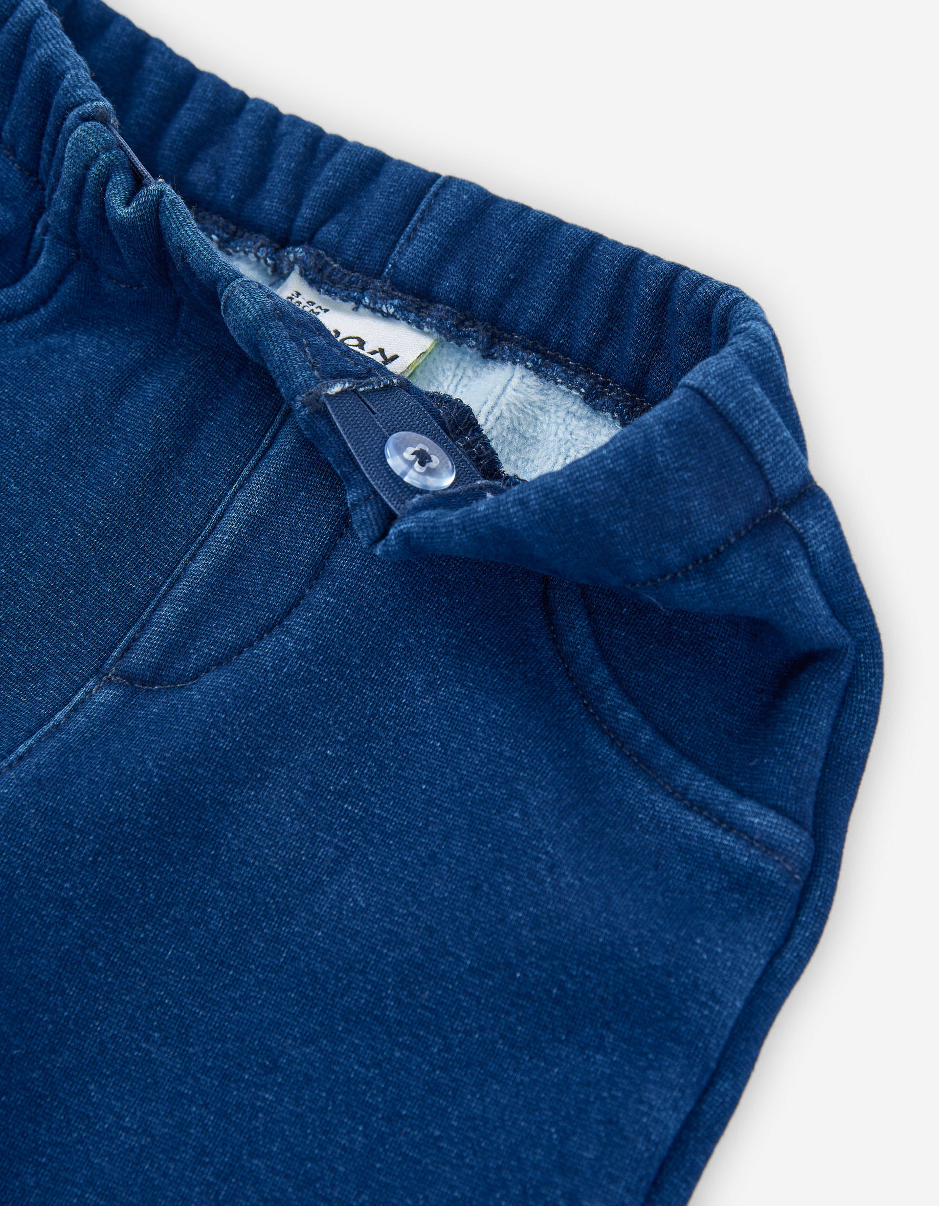 Denim trousers with fleece lining for baby girls, blue